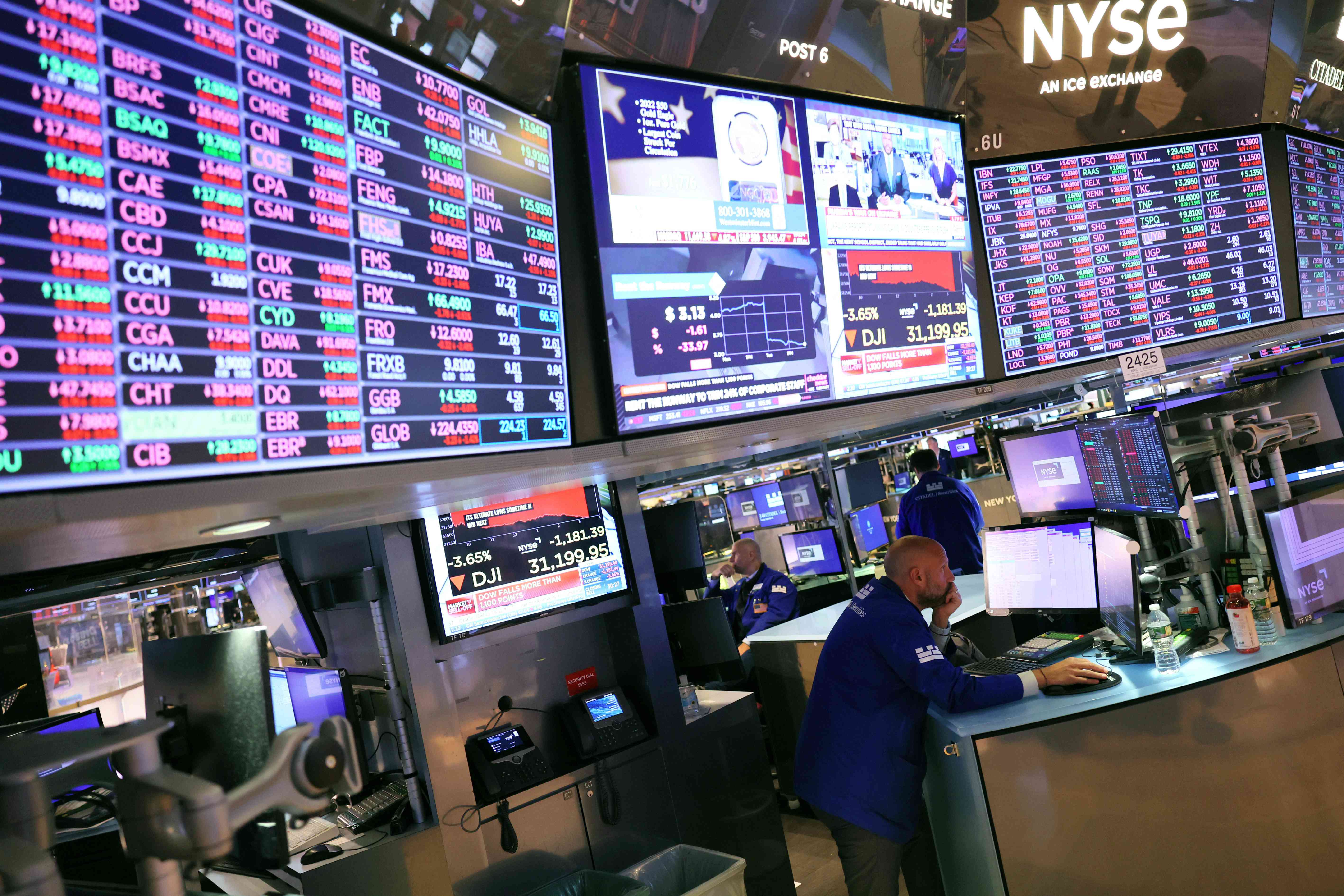 Traders work on the floor of the New York Stock Exchange